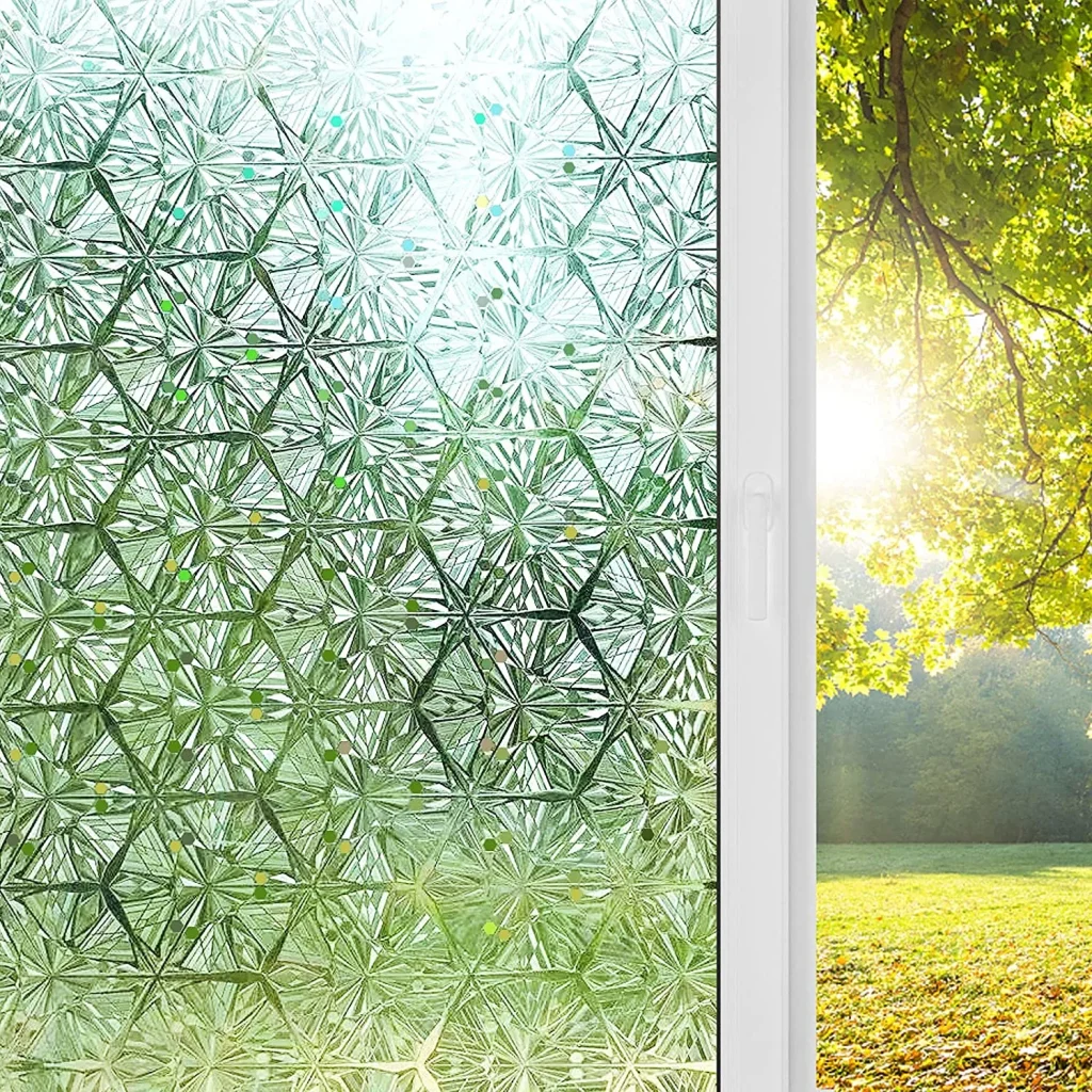 Window with frosted privacy film featuring green geometric floral pattern