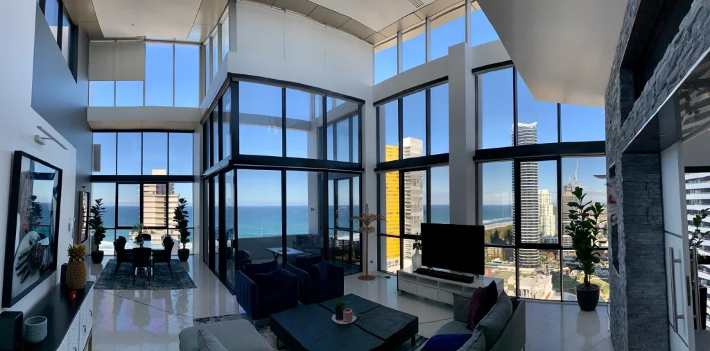 Luxury high-rise apartment with floor-to-ceiling windows and ocean views